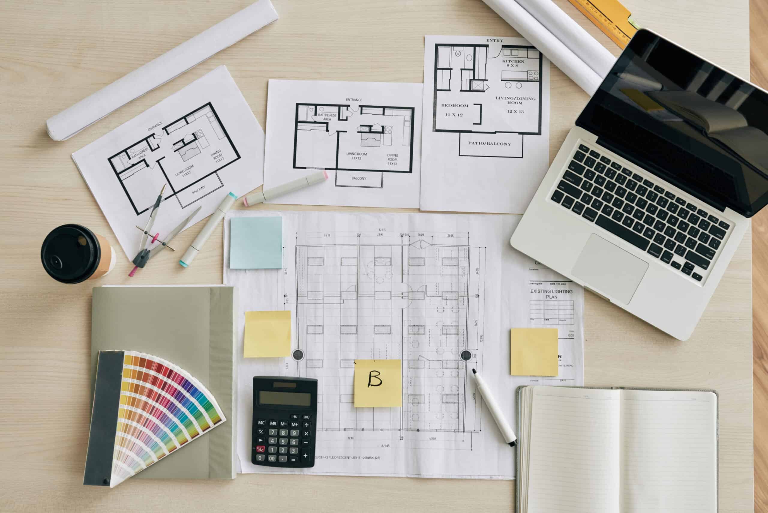Room designs on a desk with a laptop